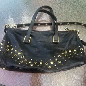 Juicy Couture genuine leather studded satchel w/ crossbody strap.